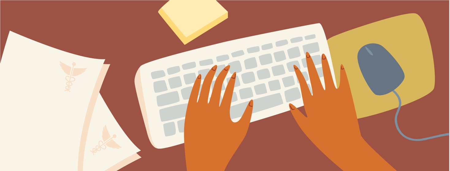 Hands are working at a desk while medical papers sit next to the keyboard