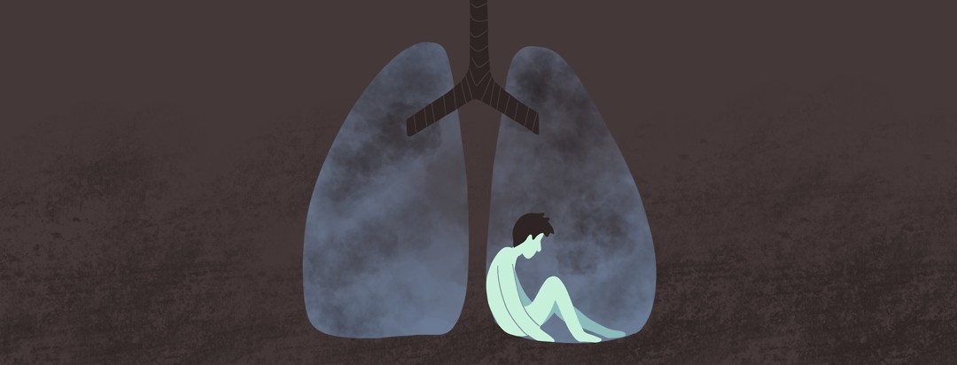 a person sits sadly inside of a smokey pair of lungs