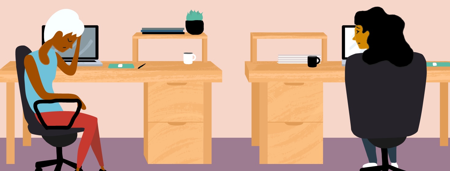 a woman looks tired at work while her coworker looks on in concern
