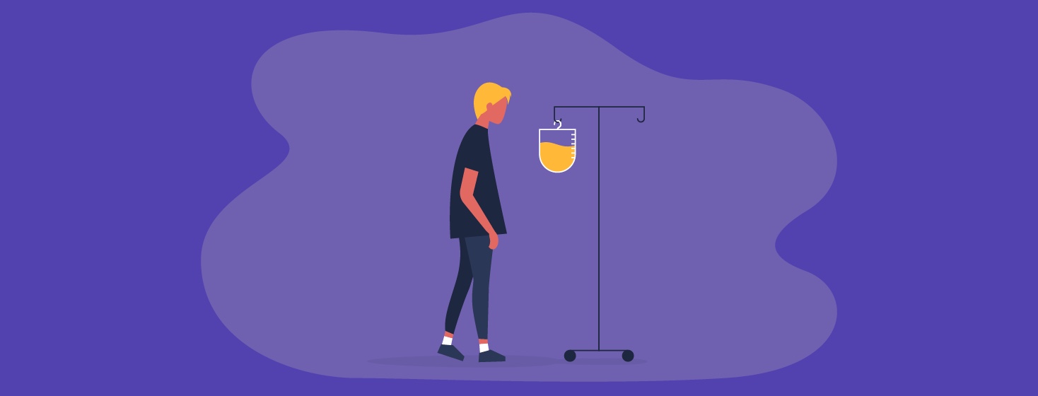 a person looks at an IV drip bag filled with chemo drugs