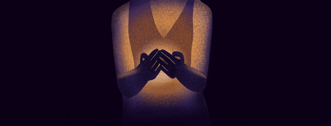 A woman holds a light in her hands