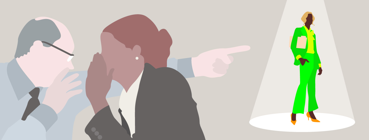 Two people in business attire whisper and point at a woman in a spotlight