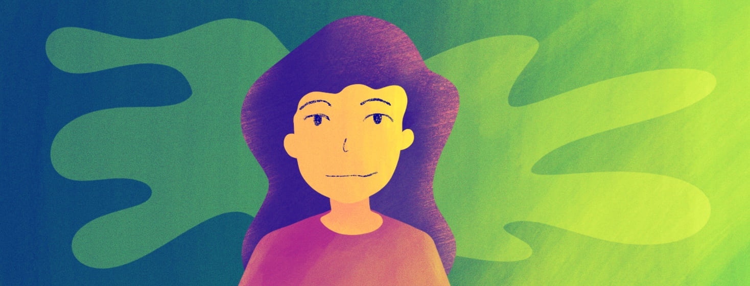 A woman looks optimistic as she slightly smiles, looking forward