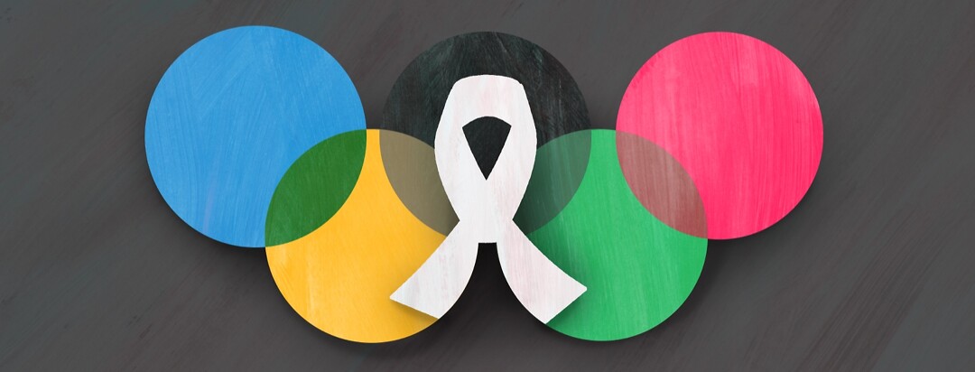 The olympic rings with a cancer ribbon in the center