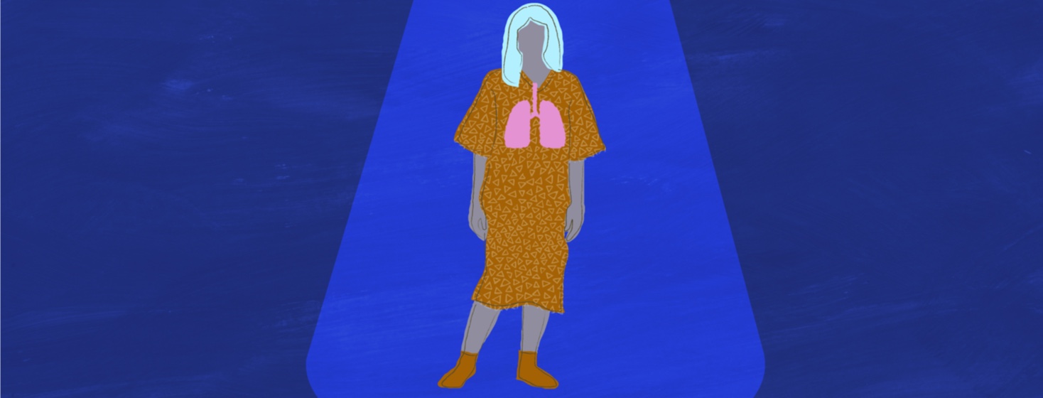 A patient with lungs standing in a spotlight