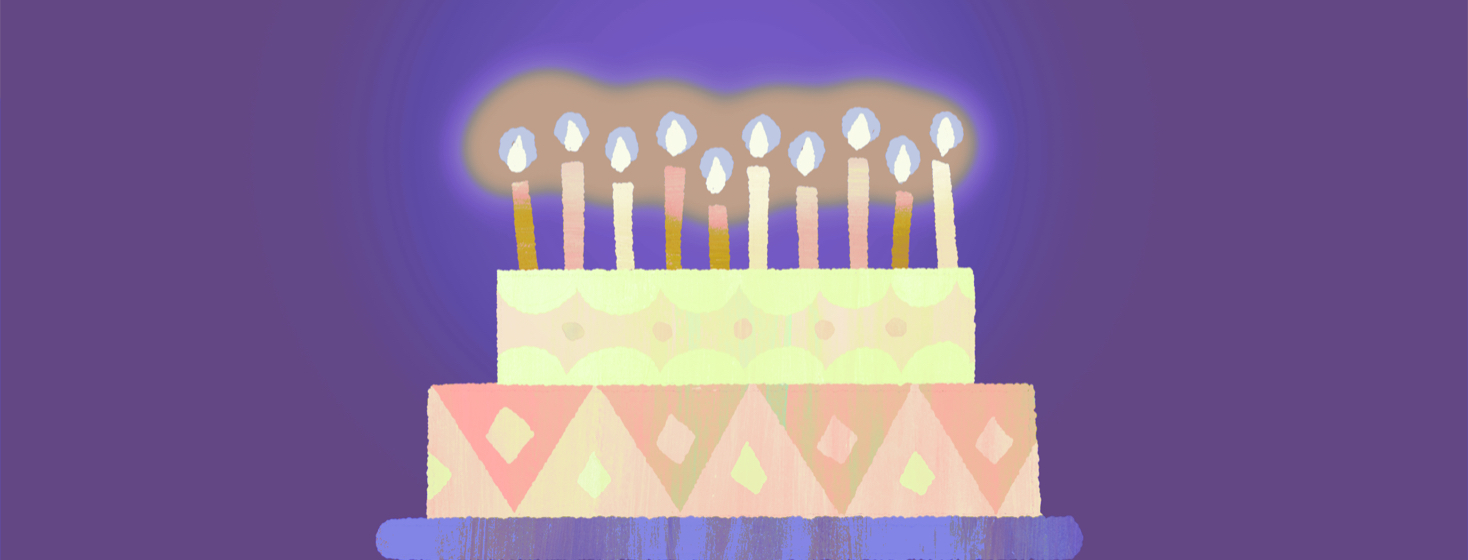 A cake with many glowing candles